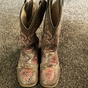 Size 2 made in India. Bought from boot barn for $80 they are used but no holes.